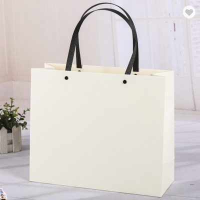 Good price Pantone Colored Kraft Paper Bag Packaging With Synthetic Handles online